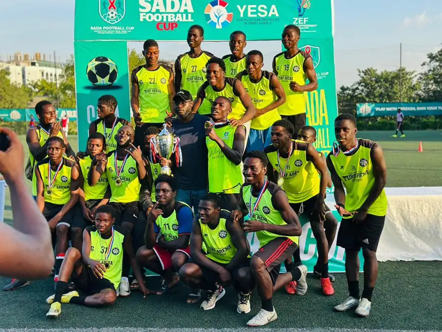 SADA Football Cup champions celebrating with the trophy